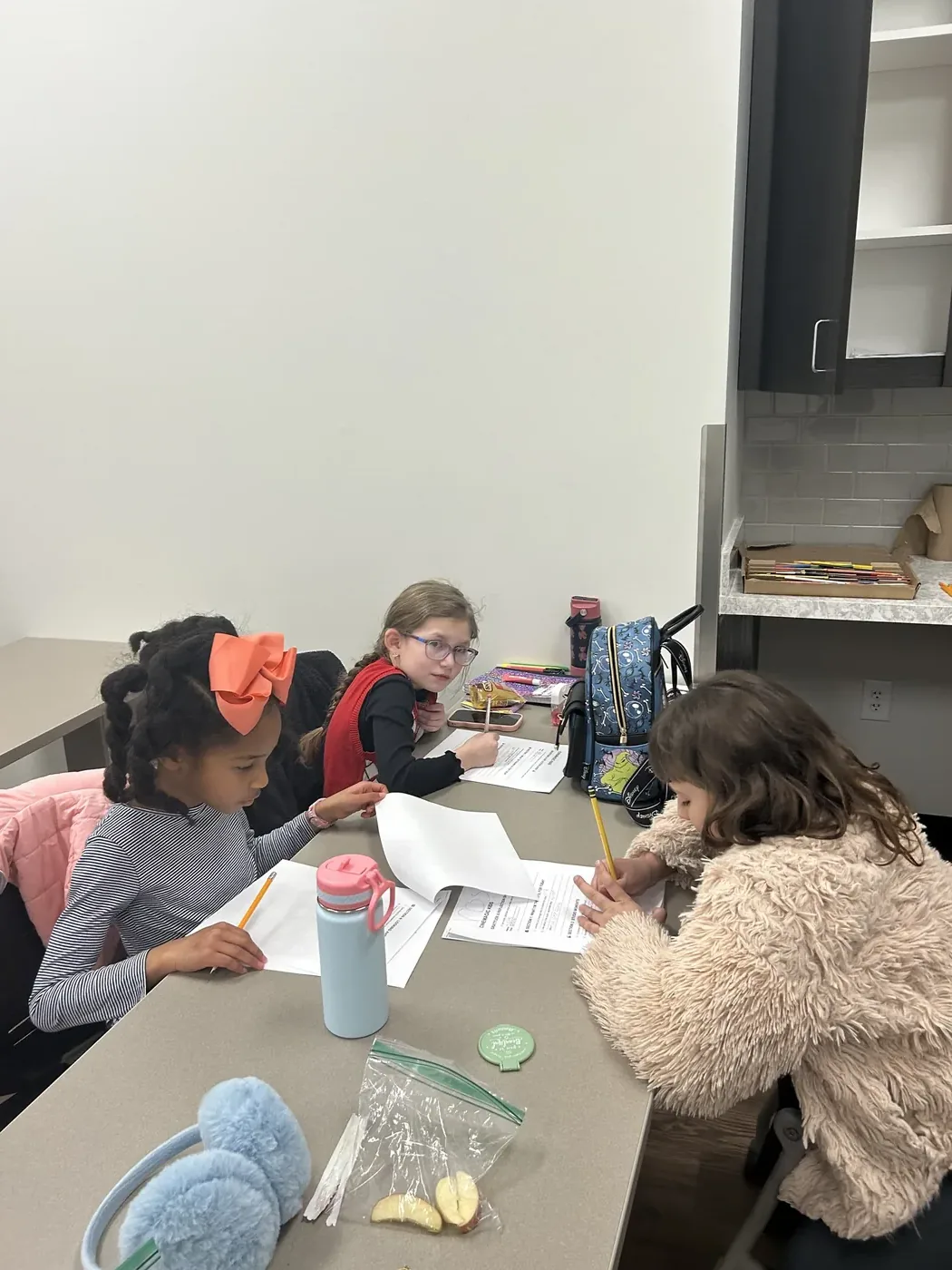 Students collaborating at the table